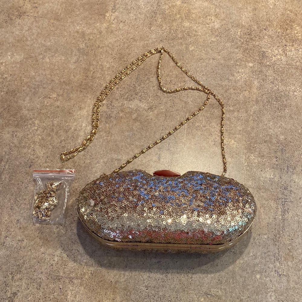 Womens gold clutch purse you can have the chain strap or tuck inside